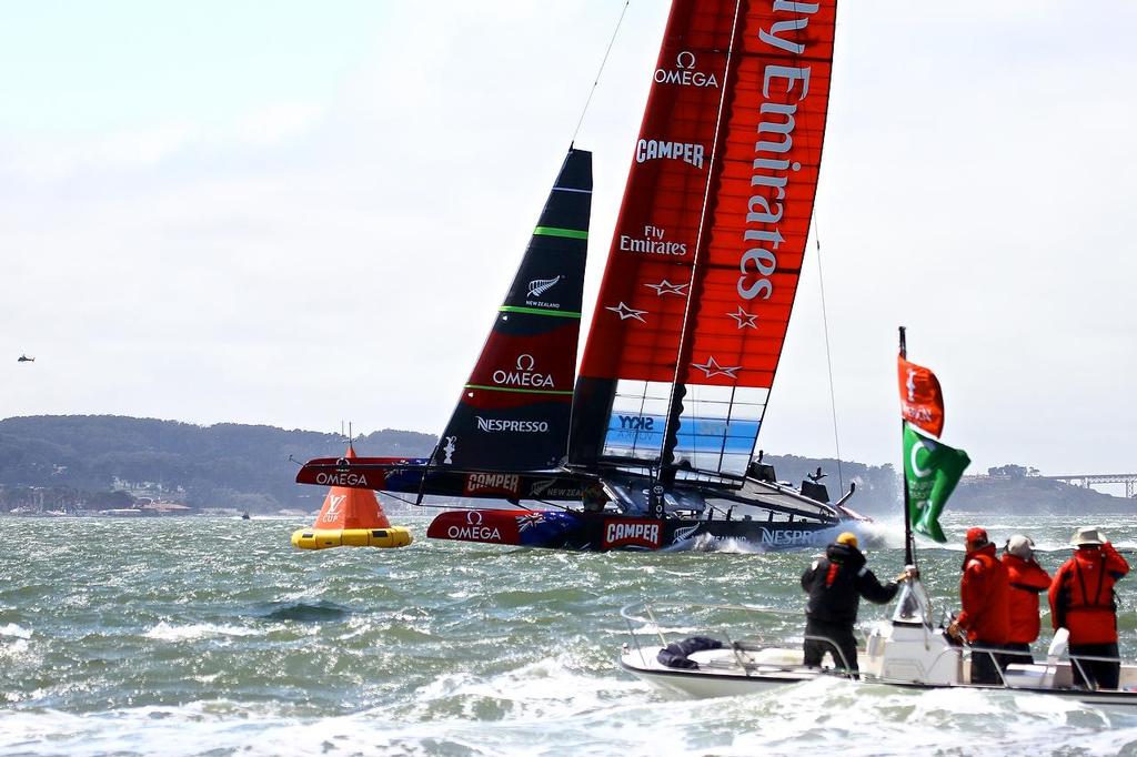 Oracle Team USA v Emirates Team New Zealand. America’s Cup Day 3, San Francisco. Emirates Team NZ makes an awesome sight rounding Mark 4 and heading for the finish line  © Richard Gladwell www.photosport.co.nz